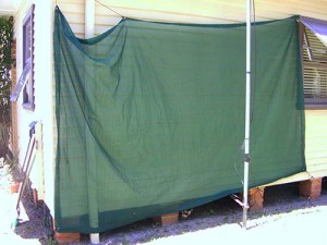 The shade cloth at the rear of the house