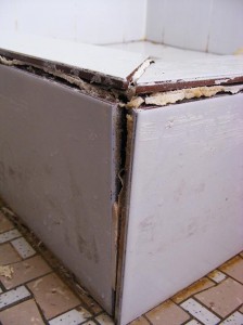 The corner showing where the material has expanded and pushed the tiles apart